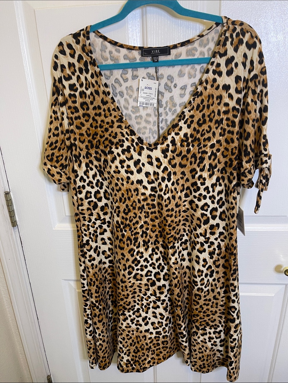 Vibe Sportswear Features leopard print on this V-Neck Tunic/Dress.